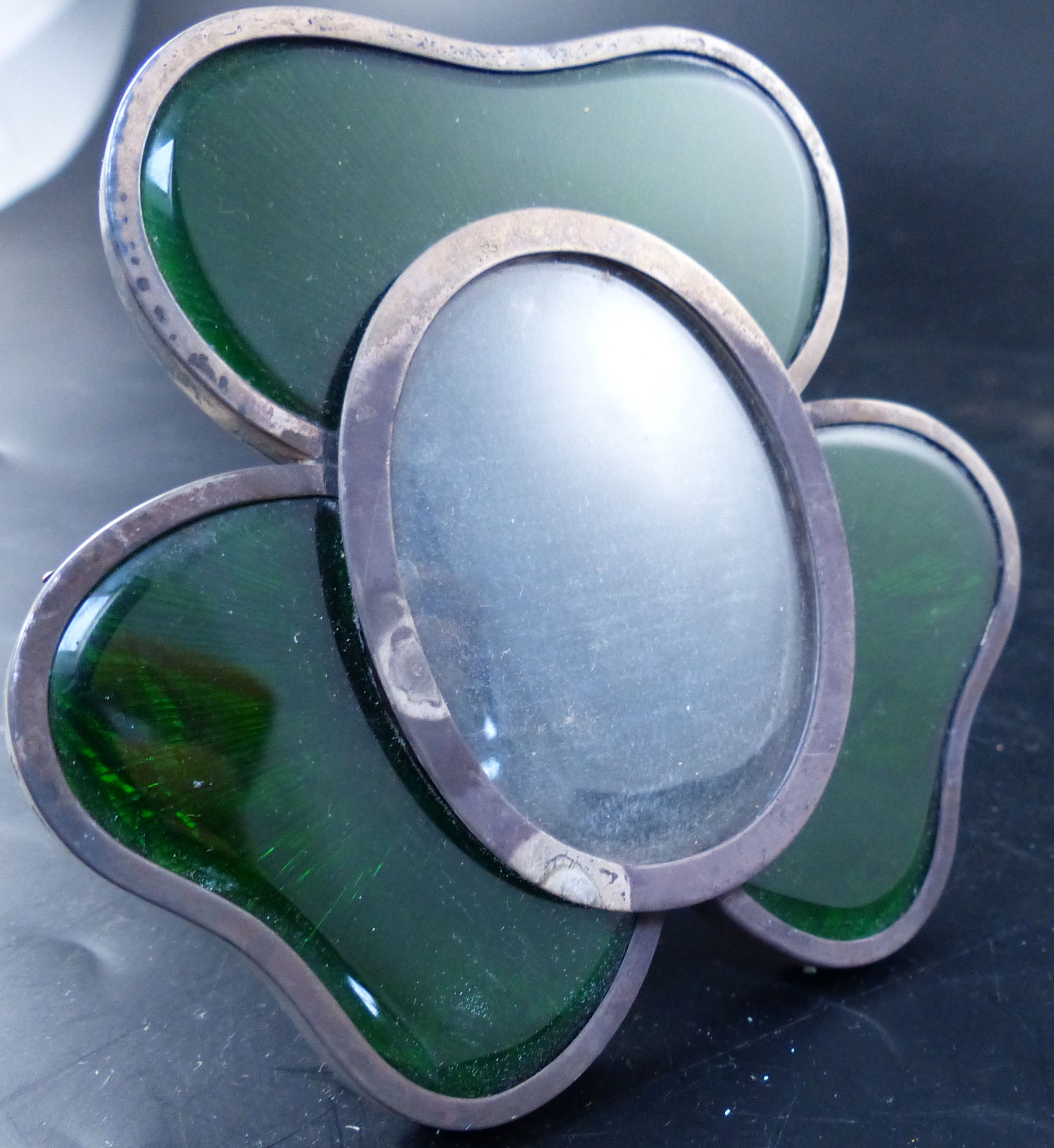 A late Victorian silver and green enamel mounted shamrock photograph frame, 97mm.